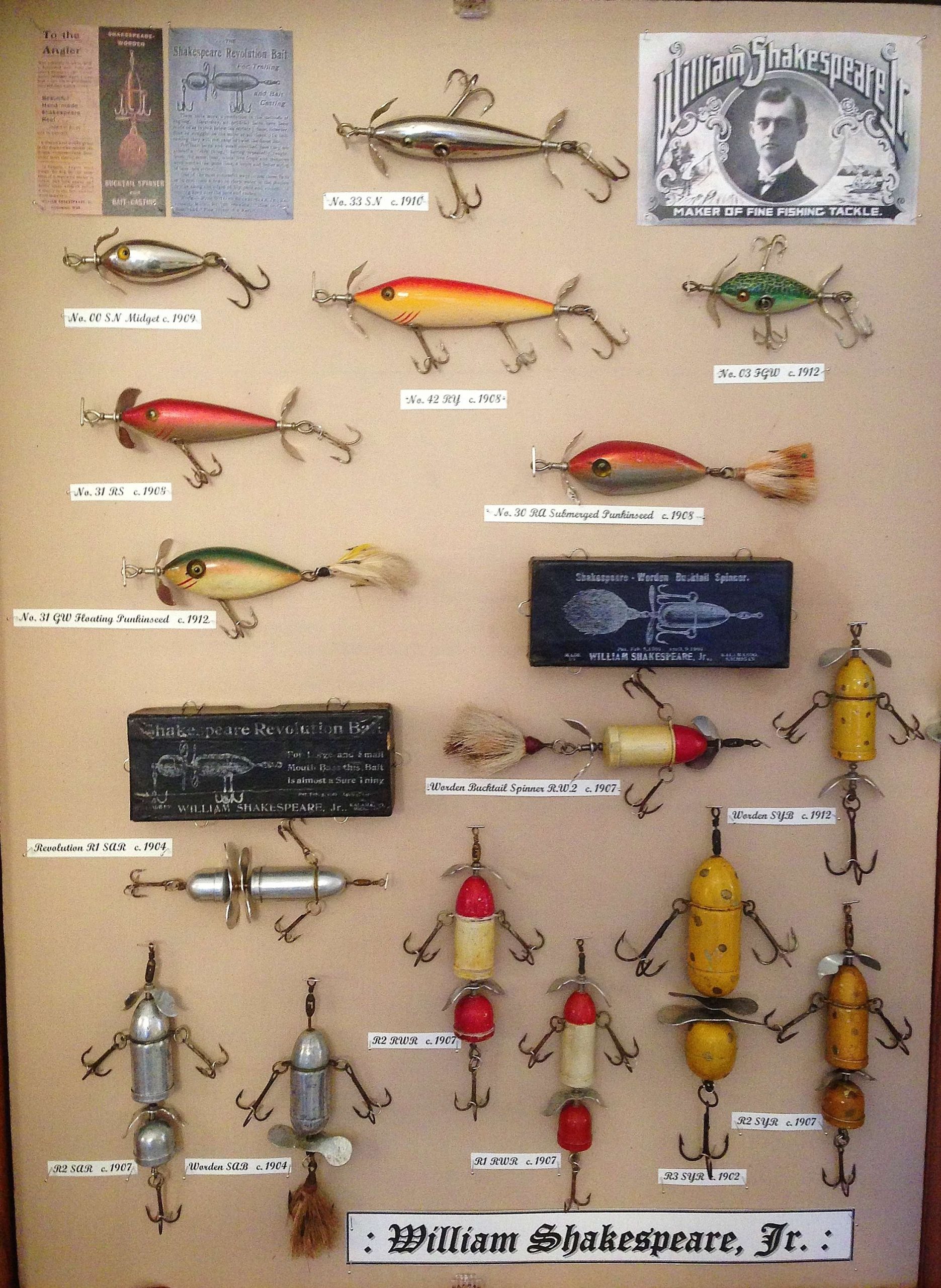 Antique fishing lures displayed on vintage net