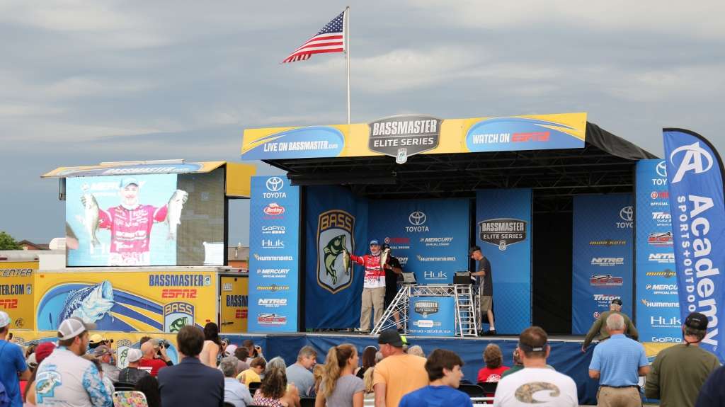 Mark Menendez holds up a nice pair of Alabama bass for an appreciative crowd.