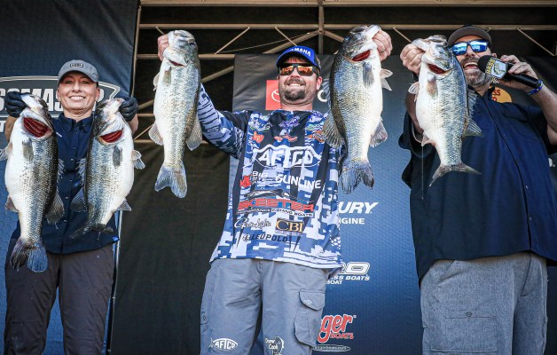 Drew Cook holds up his fish